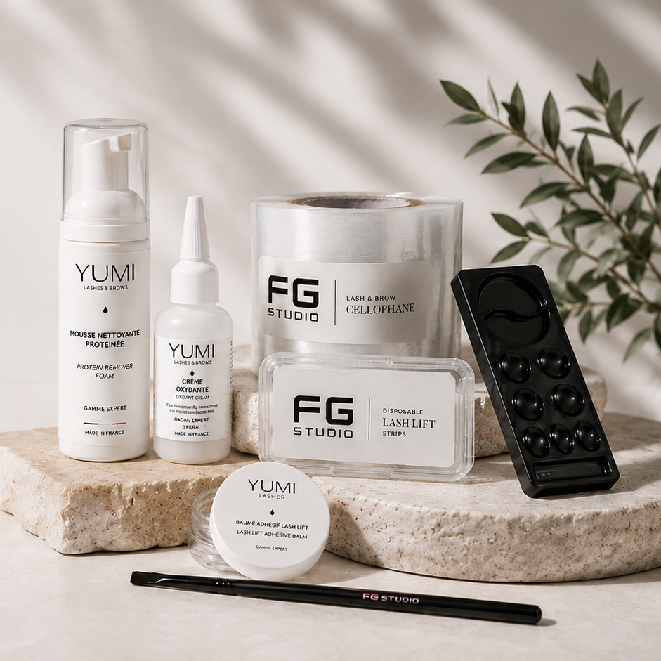 Collection of skincare products from YUMI and FG Studio on a light surface with a plant in the background.